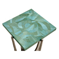 Angled top view of green square accent table.