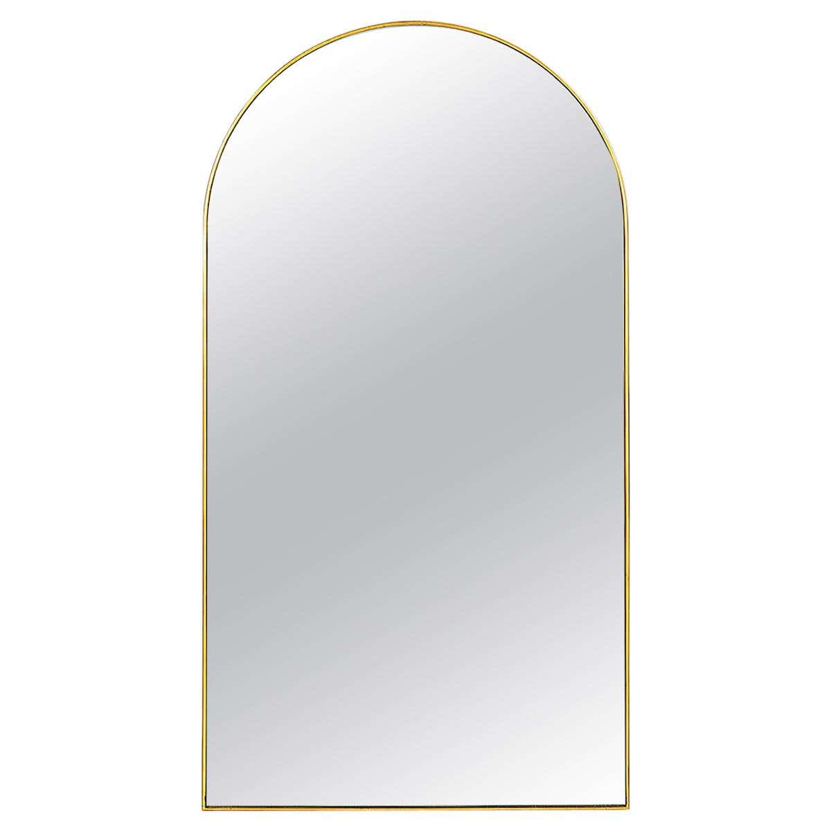 Arch top mirror with gold frame front view.