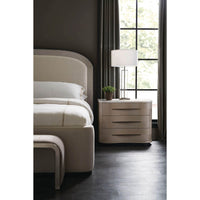 Close-up, nightstand beside Arched Art Deco Queen Bed.