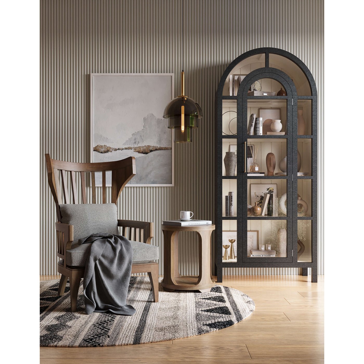 Arched display cabinet styled in room, decor inside.