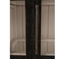 Arched display cabinet handle close-up, vertical orientation.