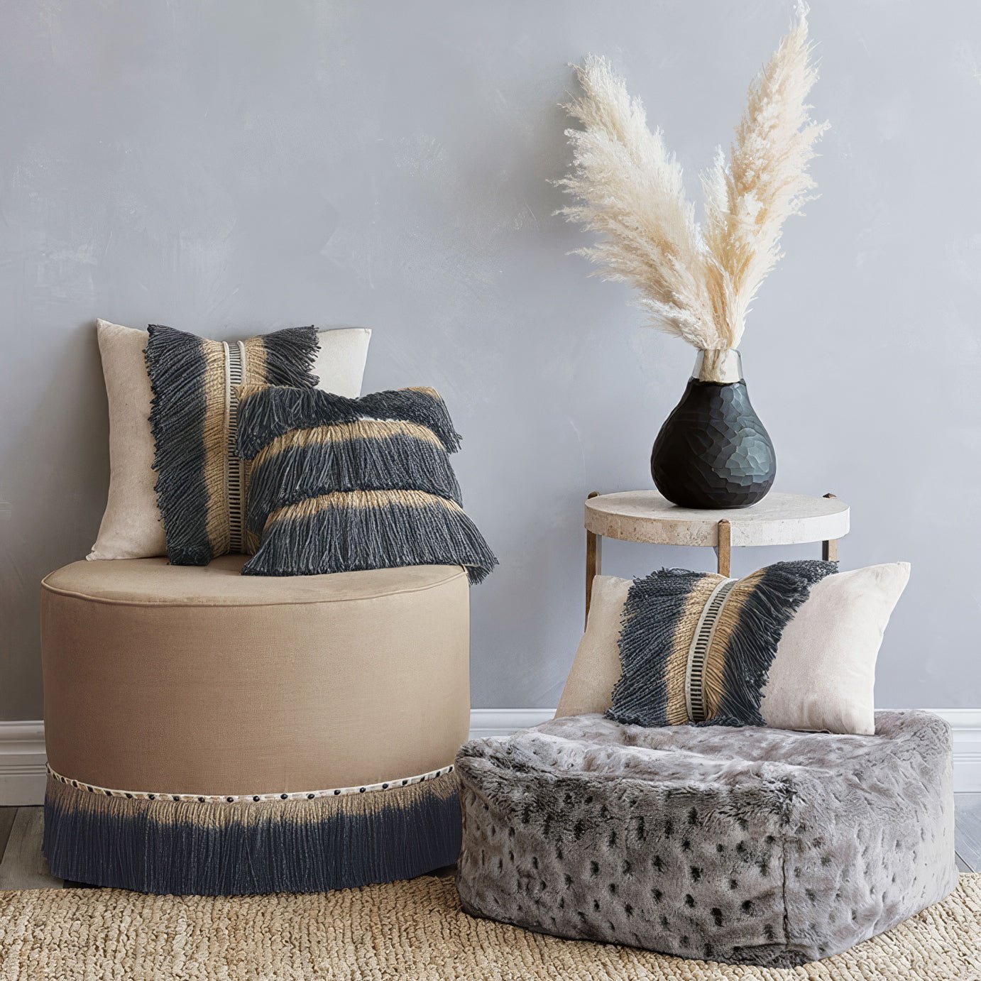 Living room with pouf and decor, styled setting.