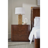 Art Deco nightstand detail with lamp and decor.