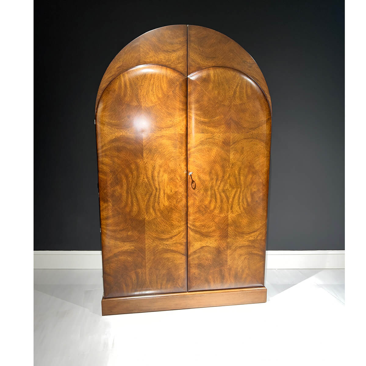 Closed Art Deco bar cabinet in room setting.
