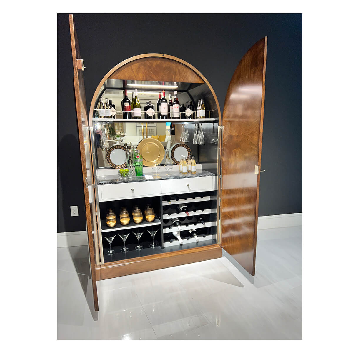 Open Art Deco bar cabinet fully stocked.