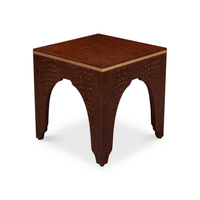 Unique arch design on textured crocodile stool.