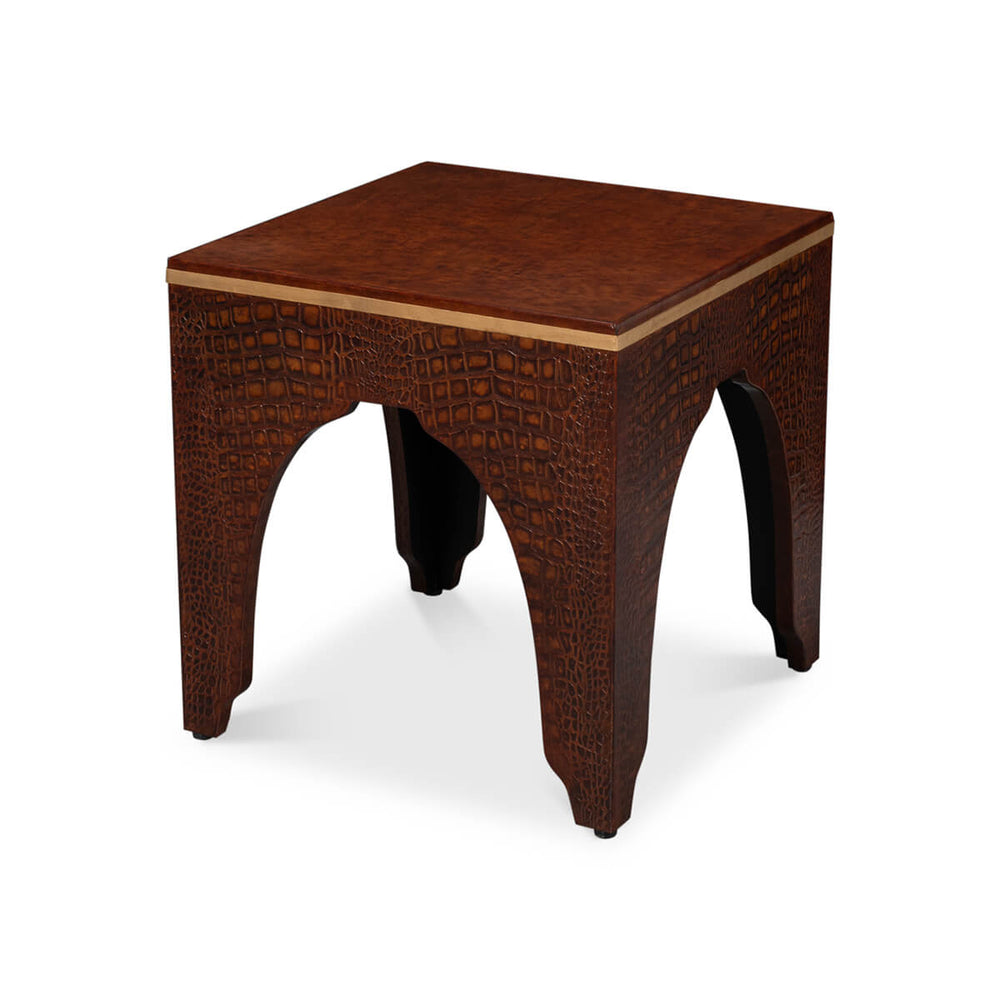 Crocodile stool angled view with textured pattern.