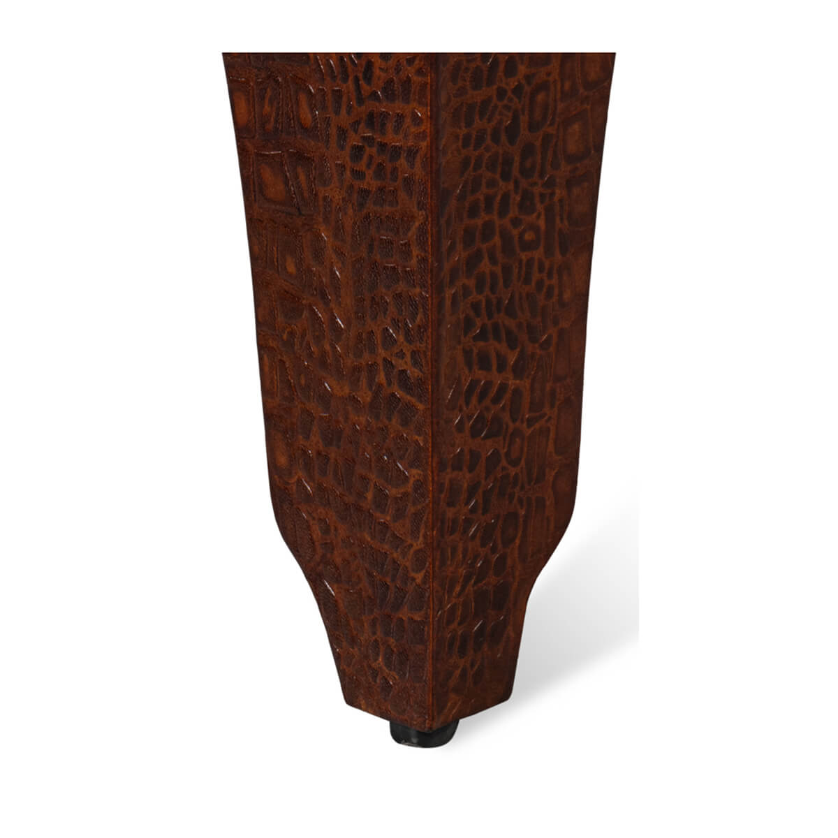 Close-up of crocodile texture on stool leg.
