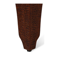 Close-up of crocodile texture on stool leg.