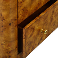 Close-up of Art Deco burl dresser drawer, gold knob.