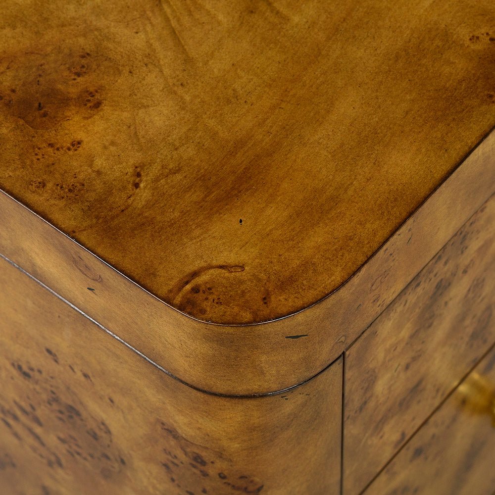 Corner detail of Art Deco burl dresser, rounded edges.