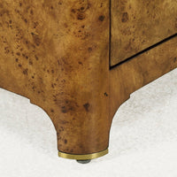 Burl nightstand leg detail with protective foot.
