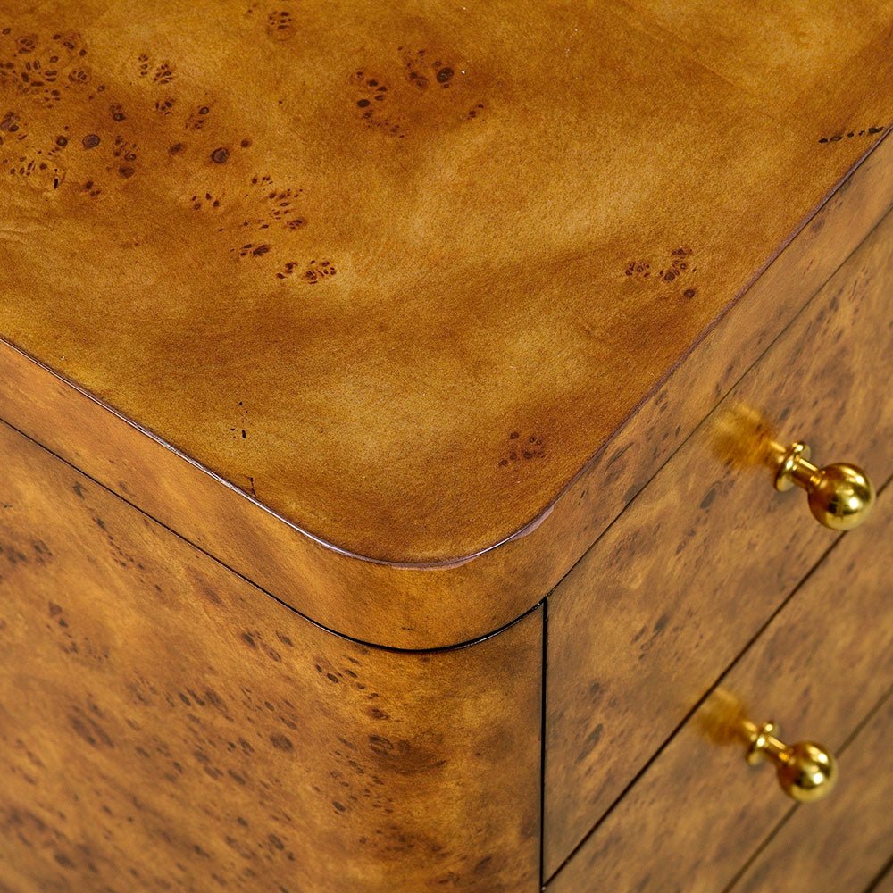Close-up of burl nightstand corner detail.