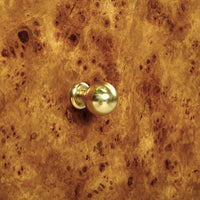 Gold knob on Art Deco burl wood nightstand.