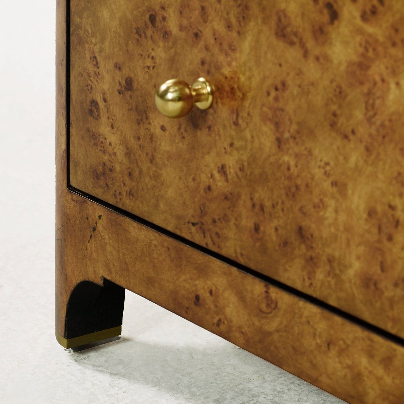 Corner view highlighting gold knob and leg design.