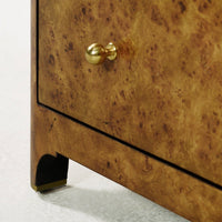 Corner view highlighting gold knob and leg design.