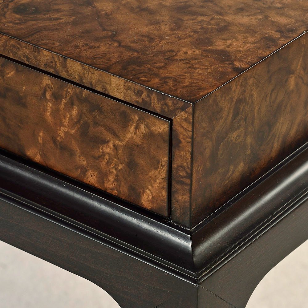 Detailed corner of walnut console showing wood grain.