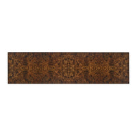 Top view close-up of burl walnut console surface.