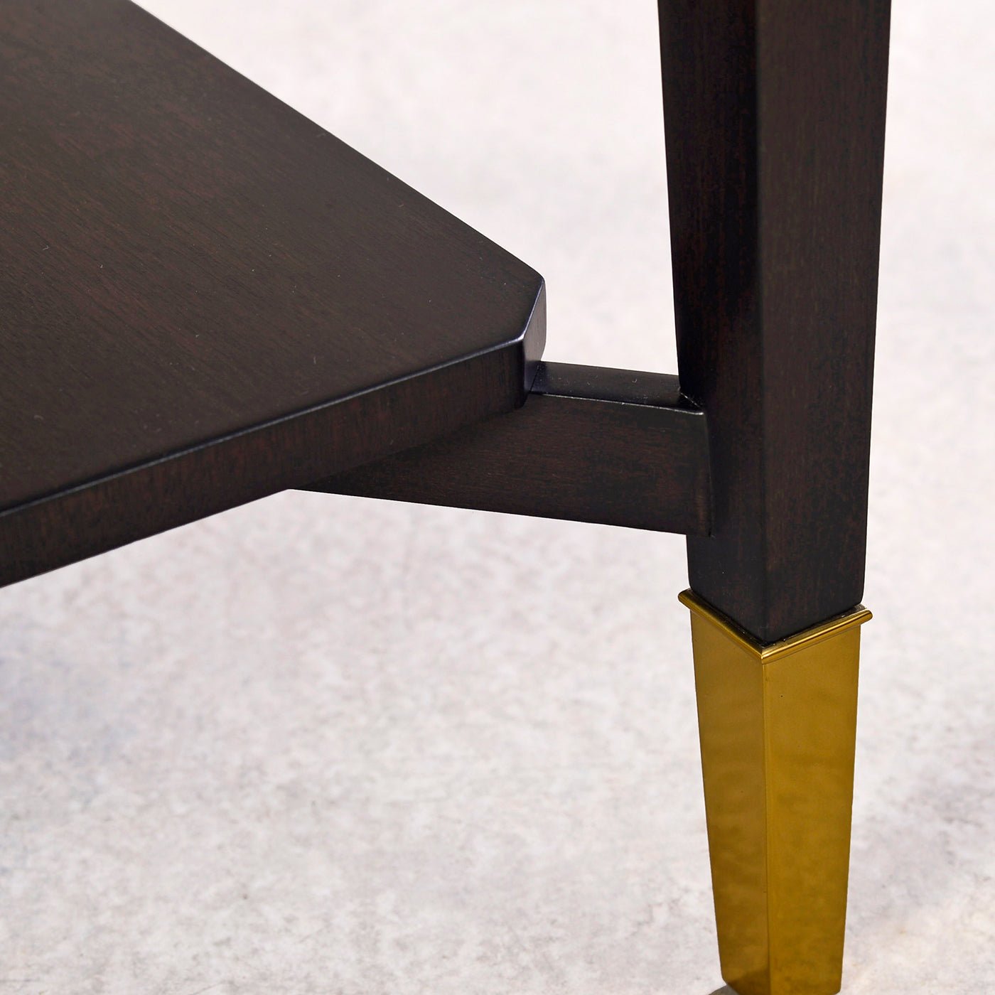 Leg detail with gold tip art deco end table.