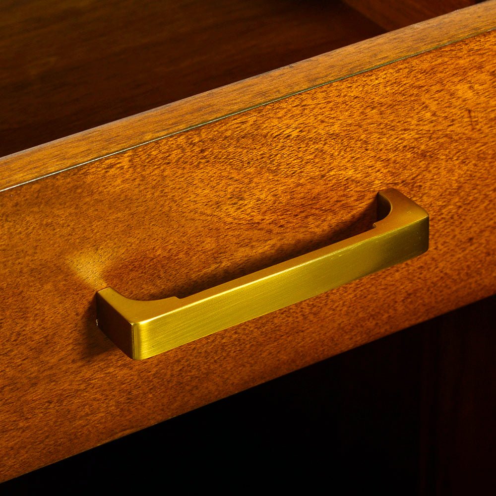 Close-up of drawer handle on bar cabinet.