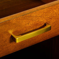 Close-up of drawer handle on bar cabinet.