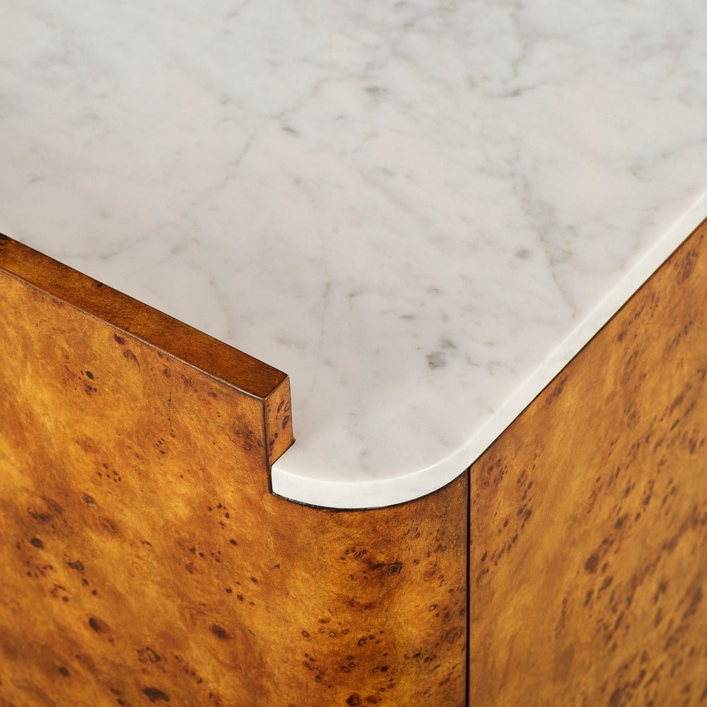 Corner detail of marble top on bar cabinet.