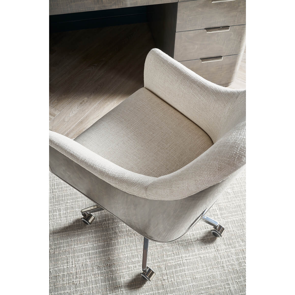 Art Deco desk chair aerial view, light fabric seat.