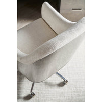Art Deco desk chair top view, soft beige cushioning.