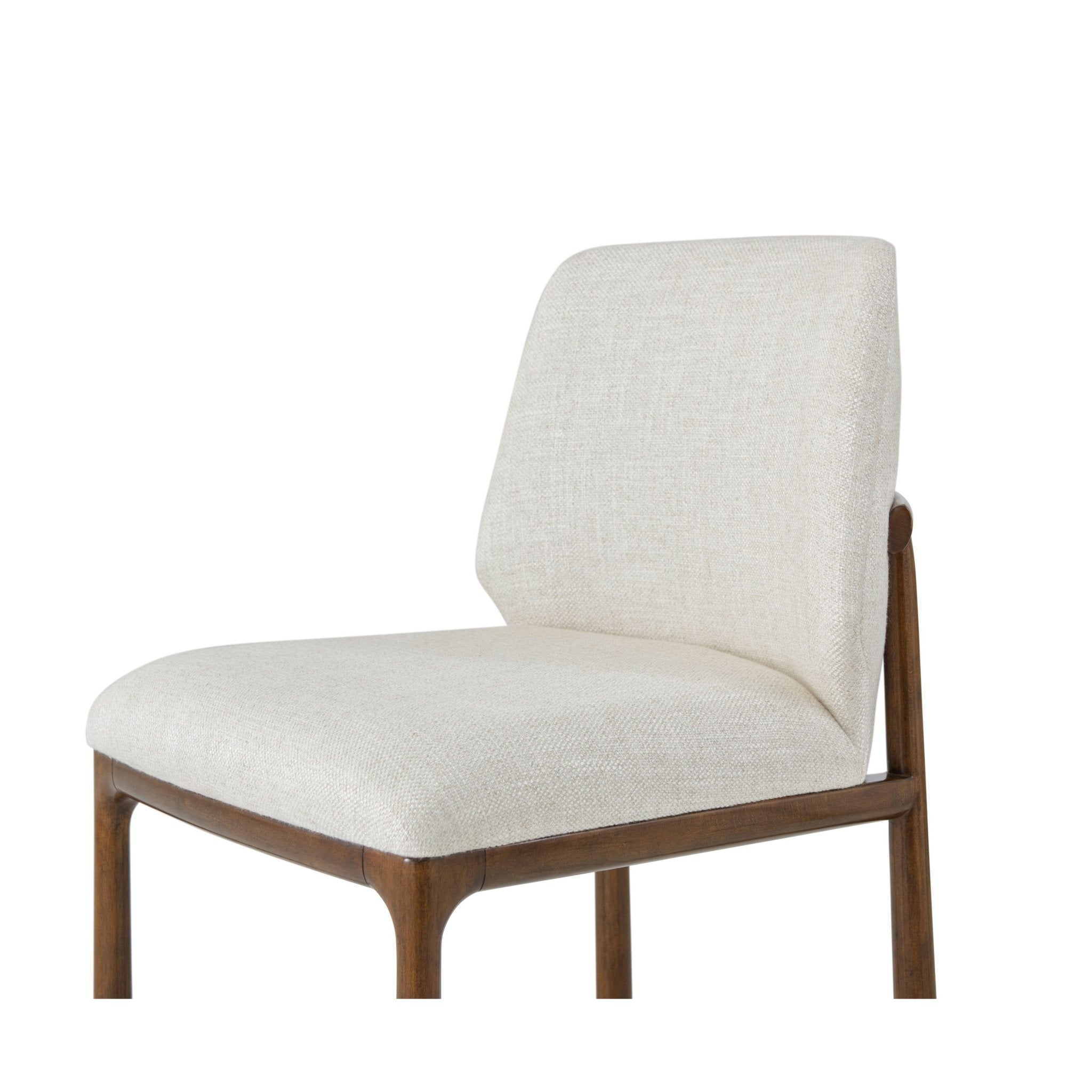 Close-up of beige dining chair cushion and backrest.