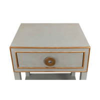 Top-down view of grey nightstand surface.