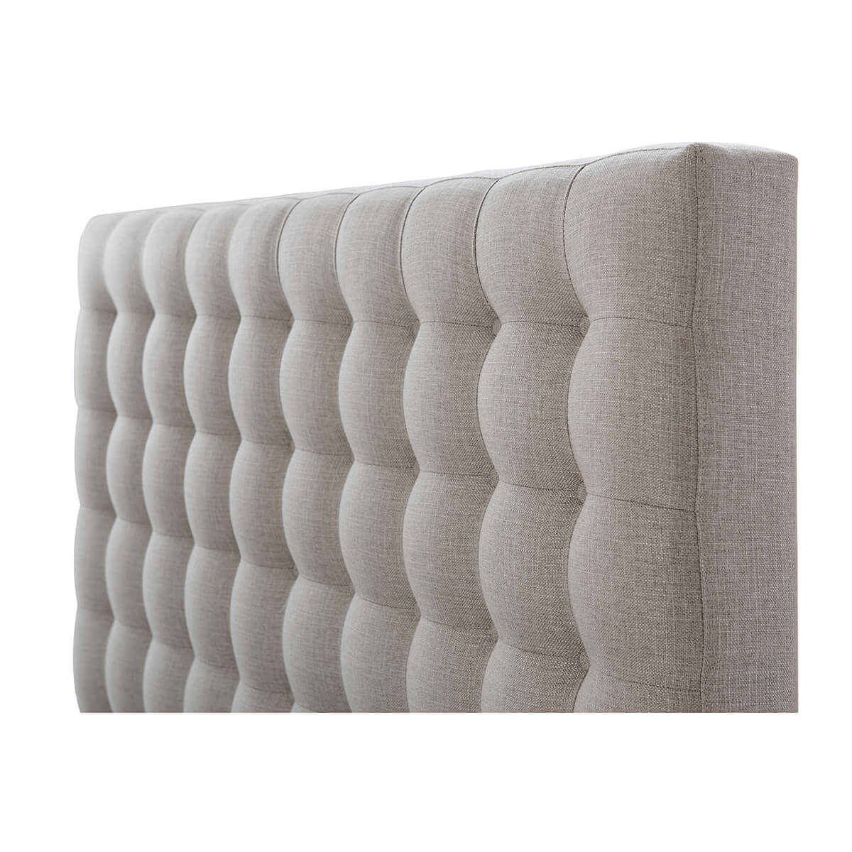 Close-up of tufted headboard on gray queen bed.