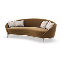 Curved kidney sofa with pillows, front angled view.