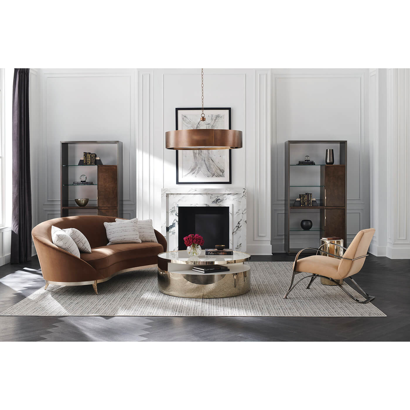 Stylish living room with brown kidney sofa centerpiece.