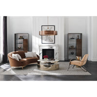 Stylish living room with brown kidney sofa centerpiece.