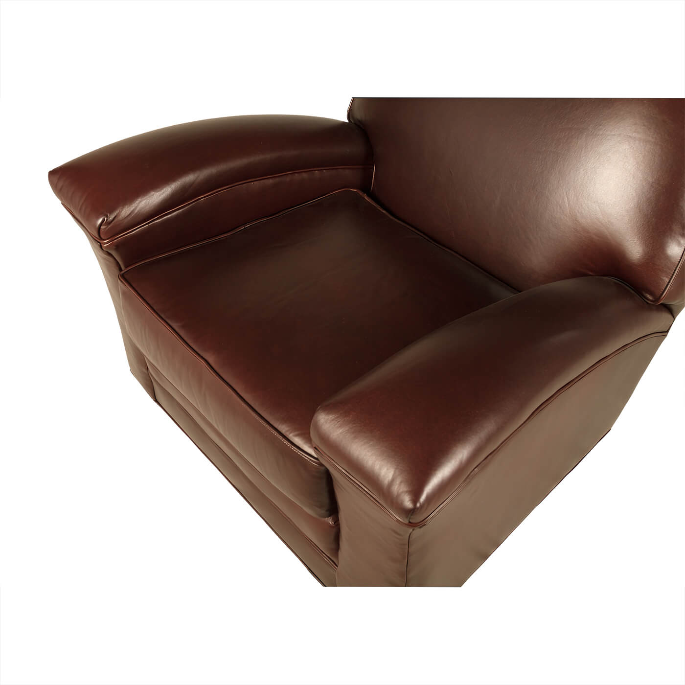 Top close-up of seat on leather club chair.