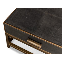 Top corner view of antique grey leather table.