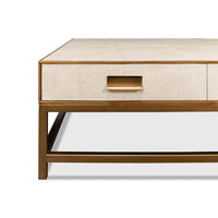 Partial side view highlighting drawer handle on coffee table.