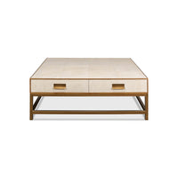 Front view of white leather coffee table with drawers.
