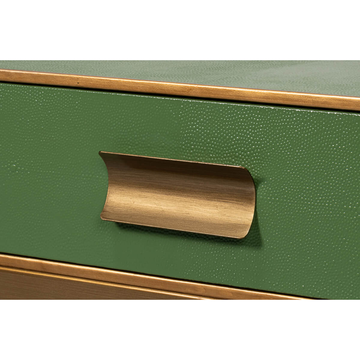 Close-up of unique drawer handle on green table
