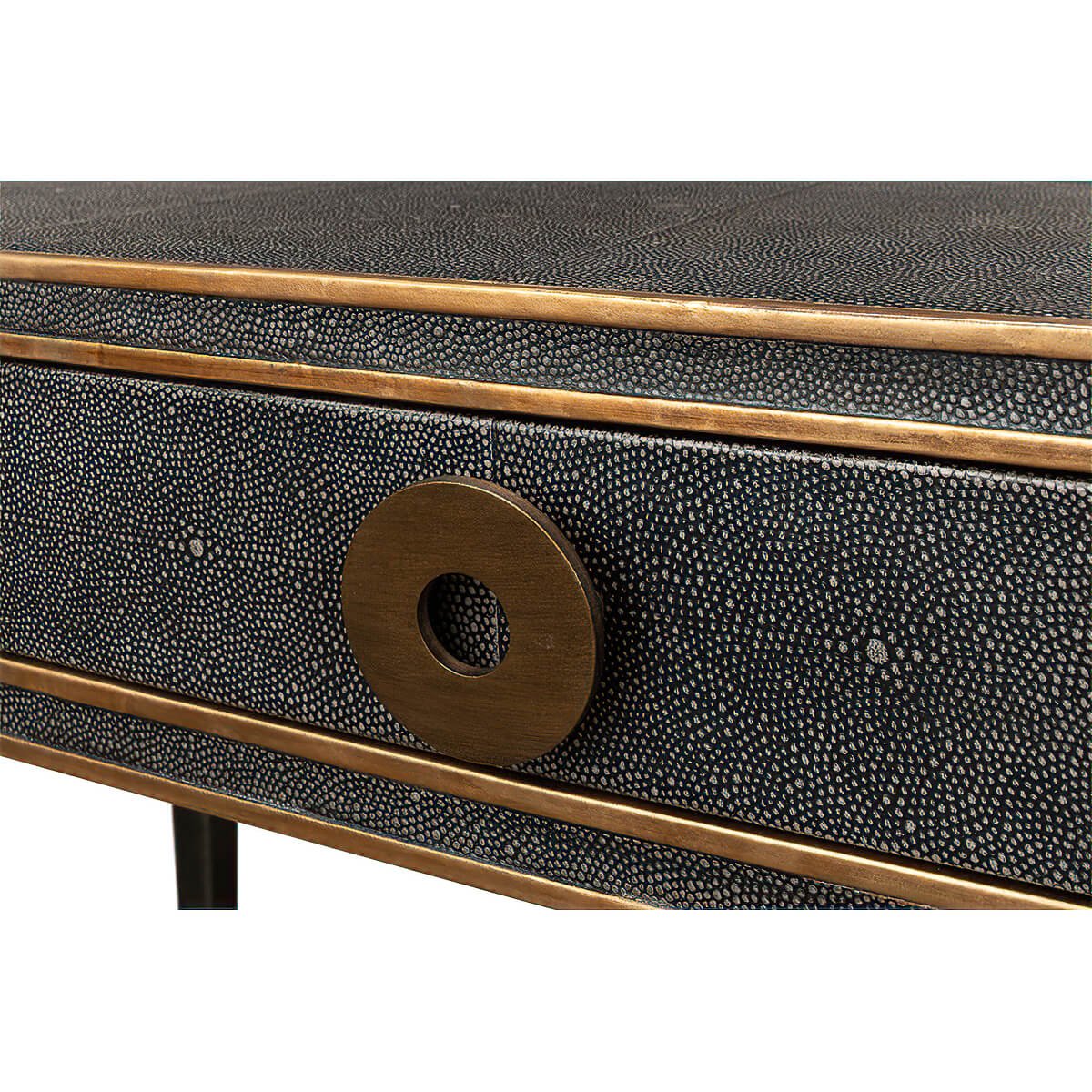 Detailed view of desk drawer knob and trim.