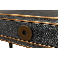 Detailed view of desk drawer knob and trim.