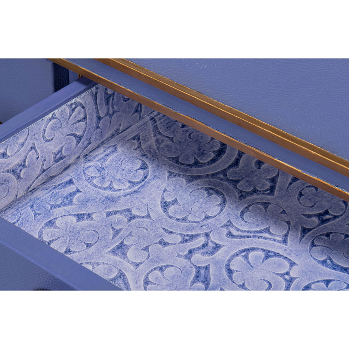 Patterned drawer interior of Art Deco leather desk.