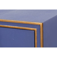 Corner detail of Art Deco leather desk with gold trim.