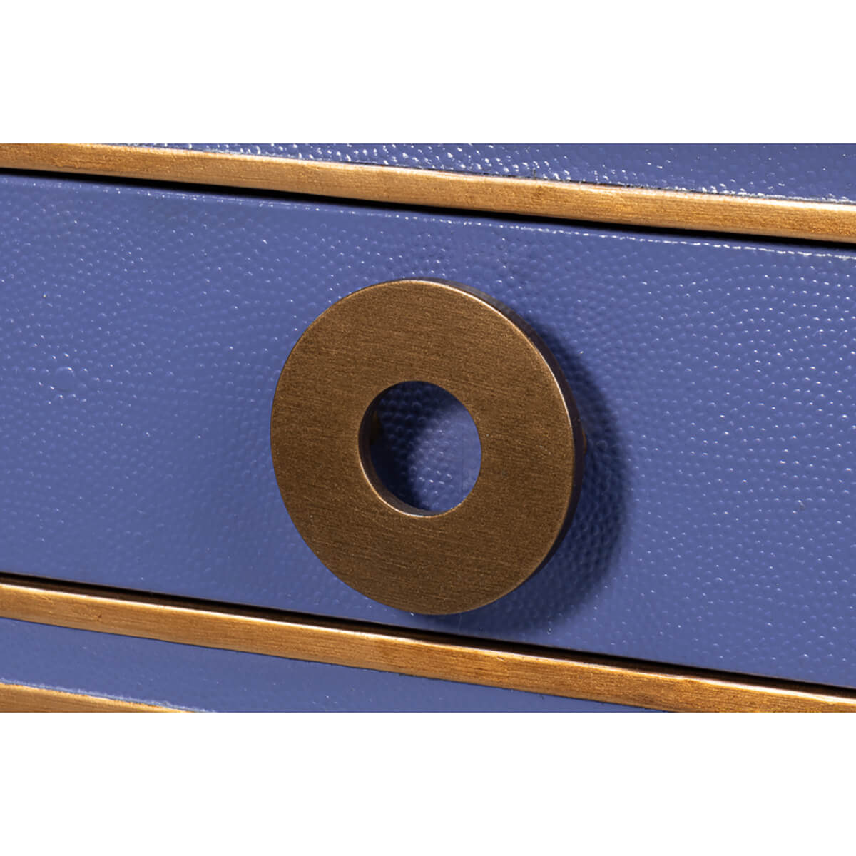 Close-up of gold handle on Art Deco leather desk.
