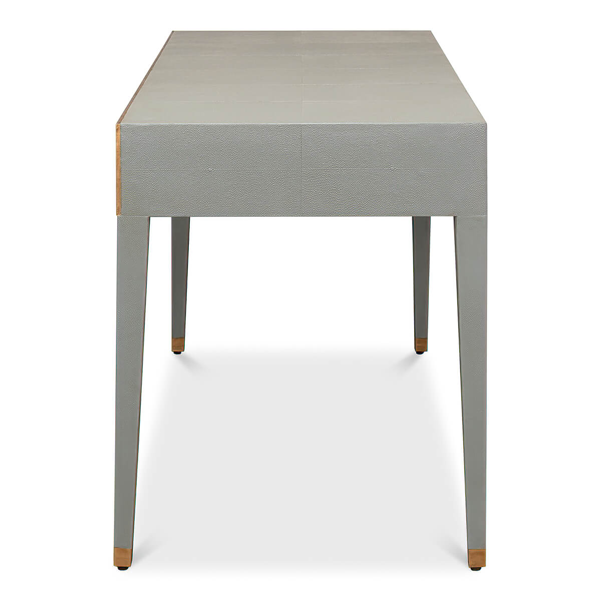 Side view of light grey desk, tapered leg detail.