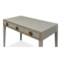 Angled view of light grey desk, detailed drawer handles.