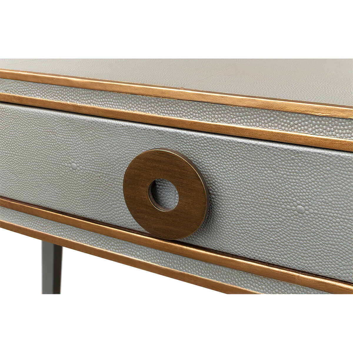 Detailed view of drawer pull, bronze circle design.