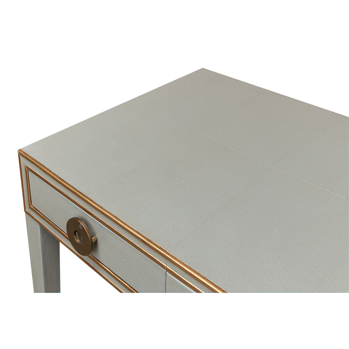 Close-up of desk surface, light grey leather texture.
