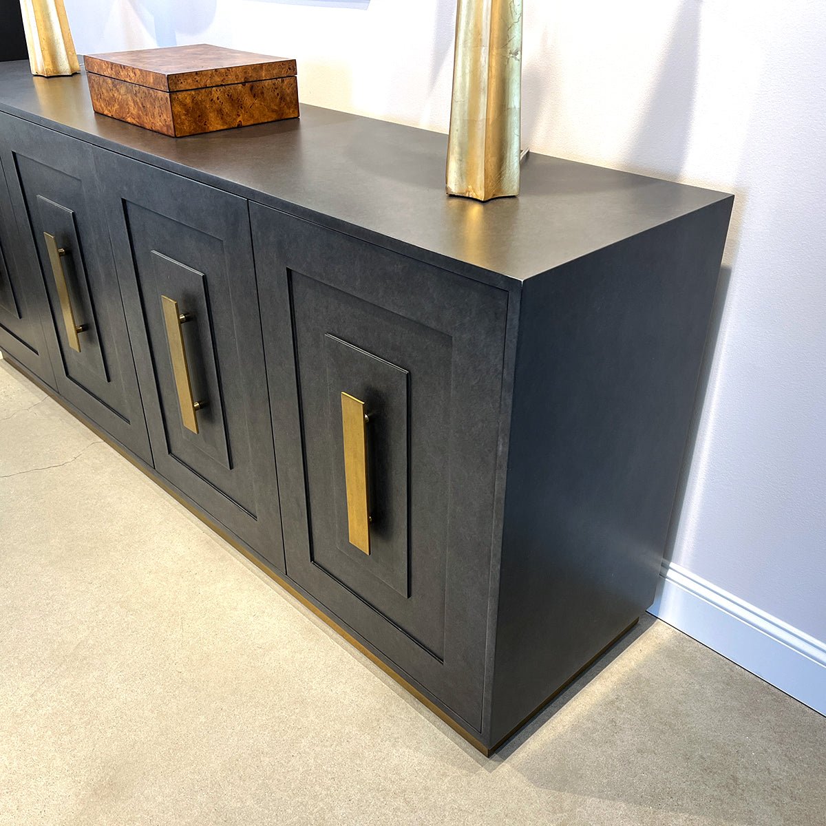Side view of Art Deco Sideboard, elegant brass accents.