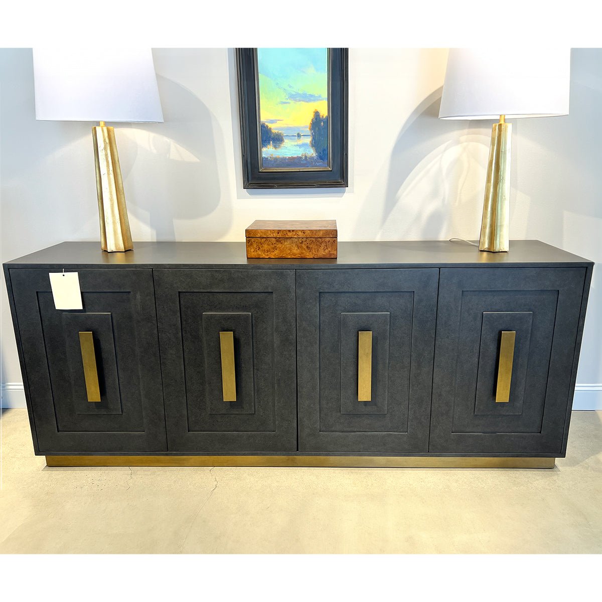 Art Deco Sideboard with lamps and artwork above.